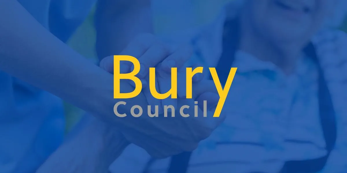 Close-up of two hands holding each other, with 'Bury Council' text over a faded background of an elderly person smiling.