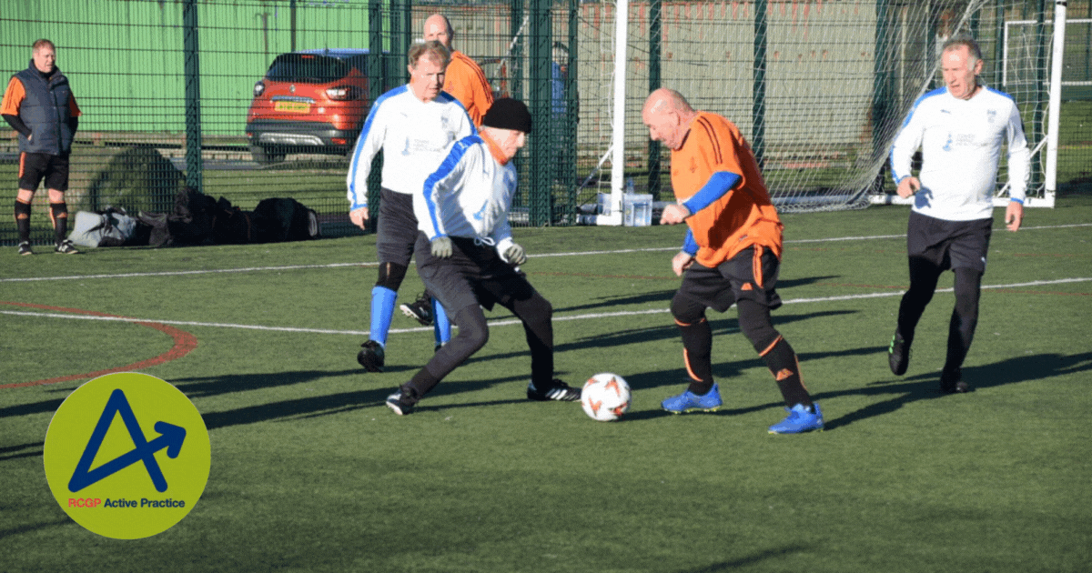 a group of men playing football on a pitch