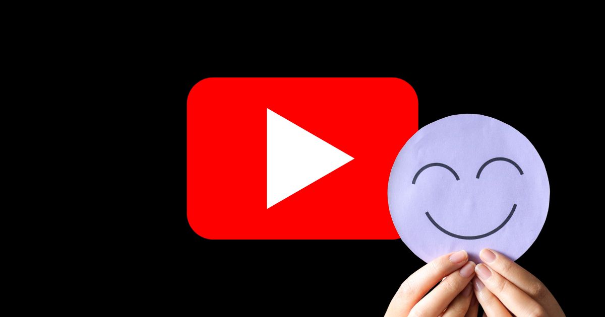 a red and white video icon alongside a pair of hands holding up a smiley face cut out