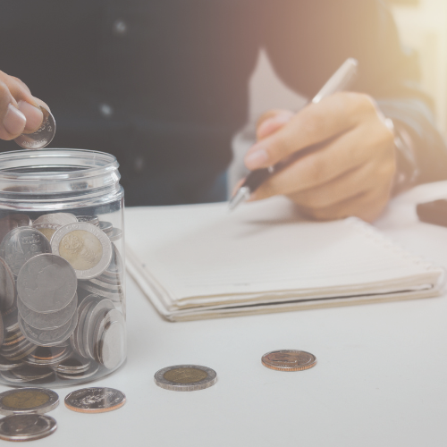 Jar of coins and a man with pen and notebook