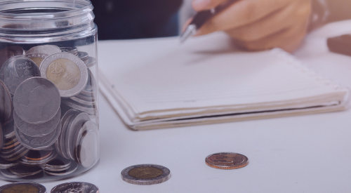Jar of coins and a man with pen and notebook
