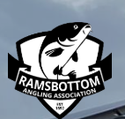 logo of a fish in a shield with Ramsbottom angling association white on blue background