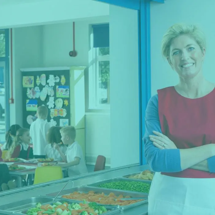 a school canteen serving health food and children sat eating